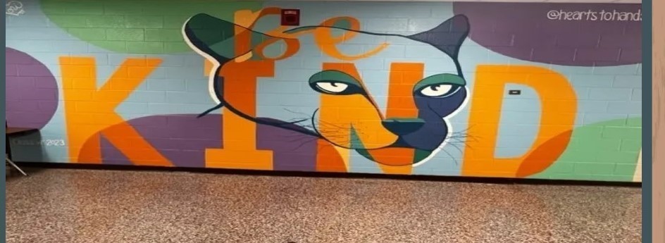Be Kind mural with a picture of a panther.